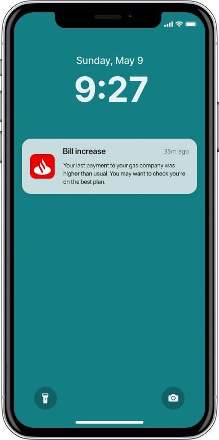 A screenshot of a mobile lock screen with a ‘Bill increase’ notification from Santander My Money Manager on it.
