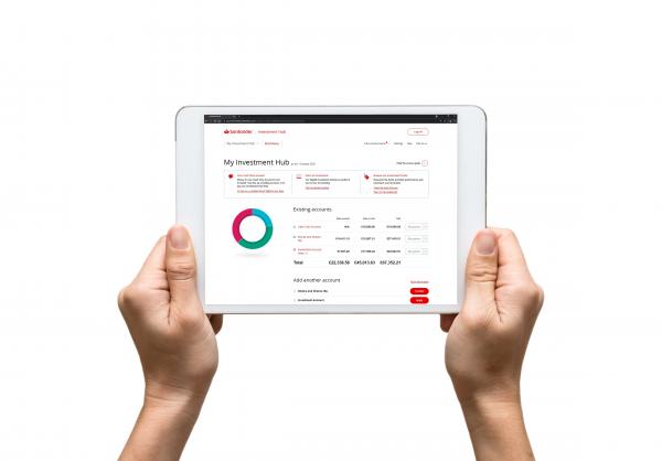 Image of hands holding a tablet device showing the Investment Hub on the screen