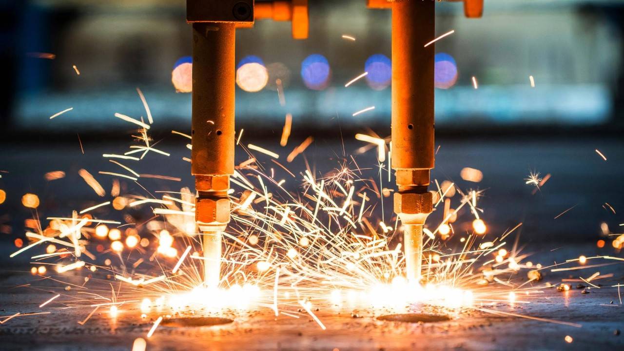 Image of welding in a manufacturing setting.