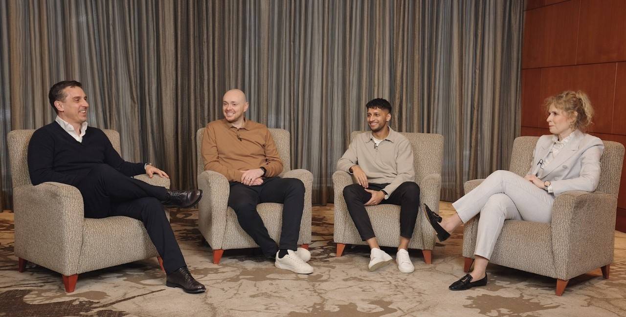 Image of Gary Neville and three other guests sat down smiling.
